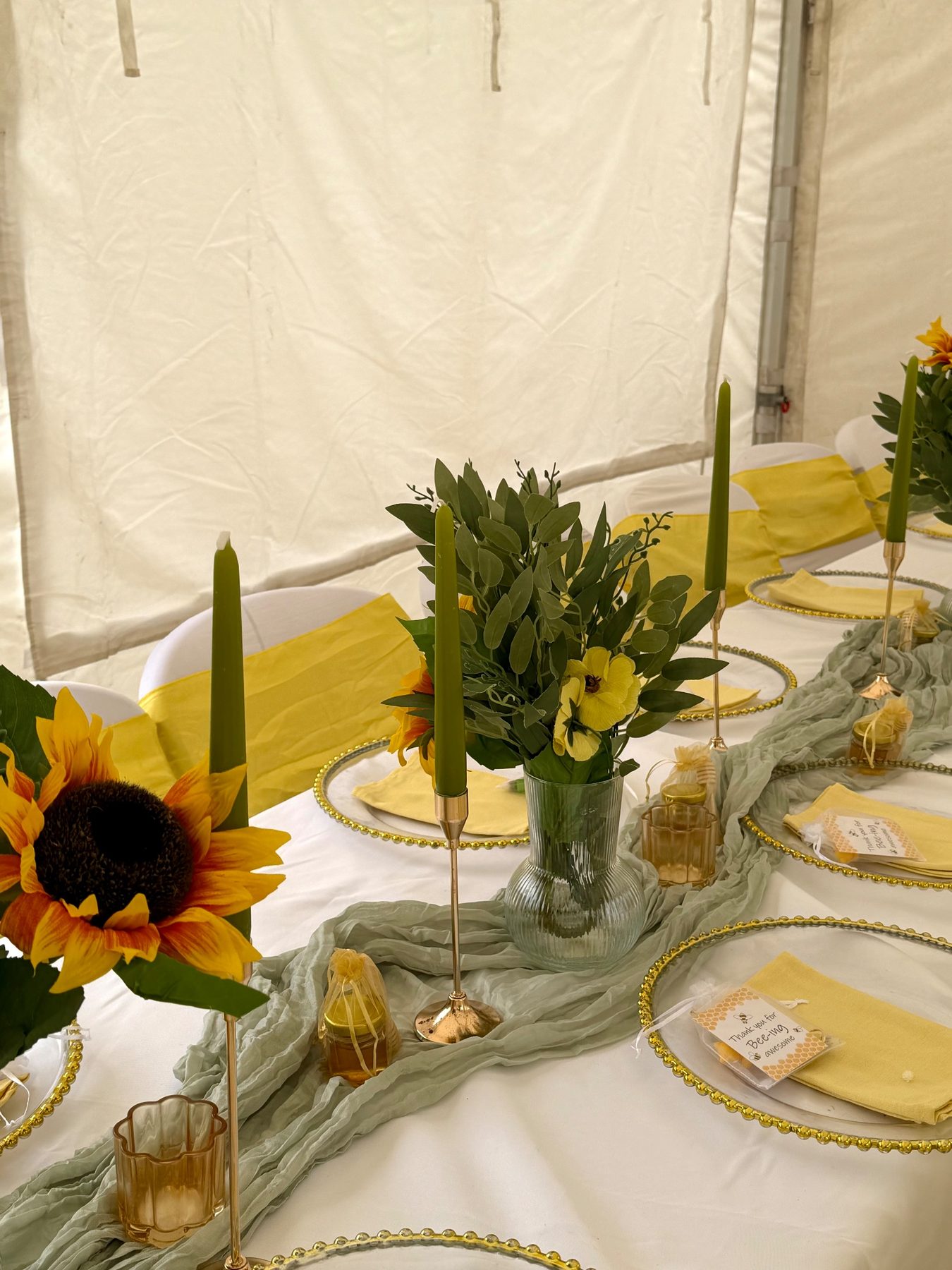 Tablescape with sunflowers, sage runners and gold chargers